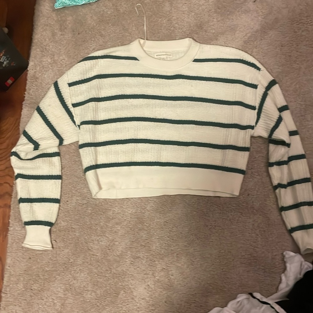 This is a white with green stripes cropped sweater. It’s a Medium.